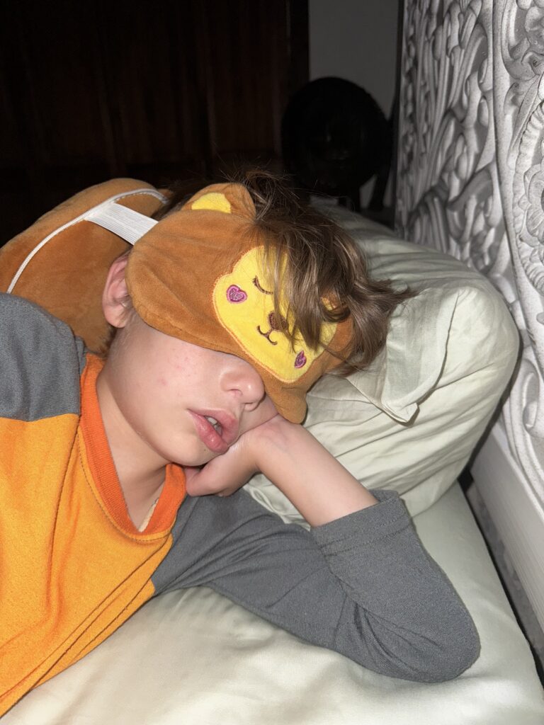 Sleeping Child, boy asleep, child sleeping with face mask, kid sleeping in parents' bed