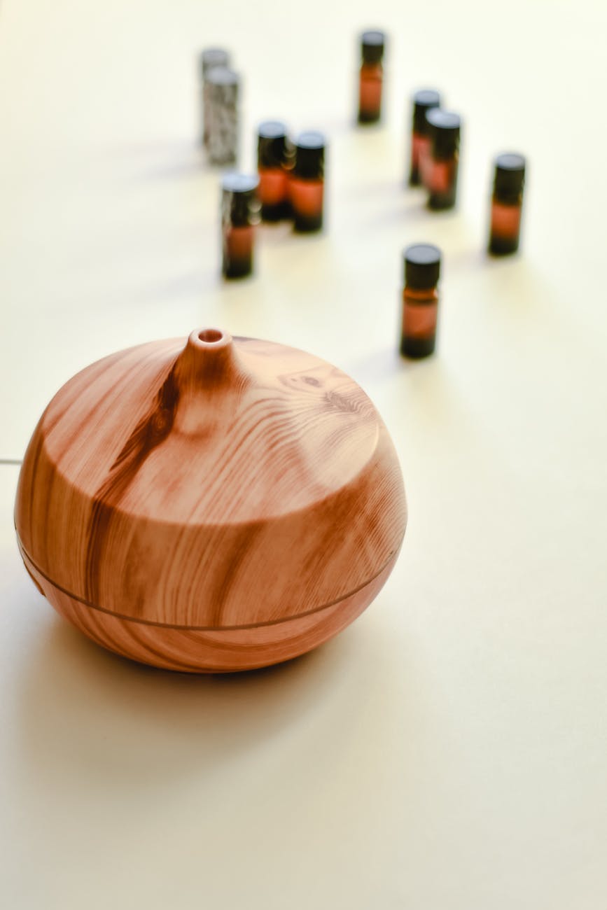 wooden oil diffuser on white surface